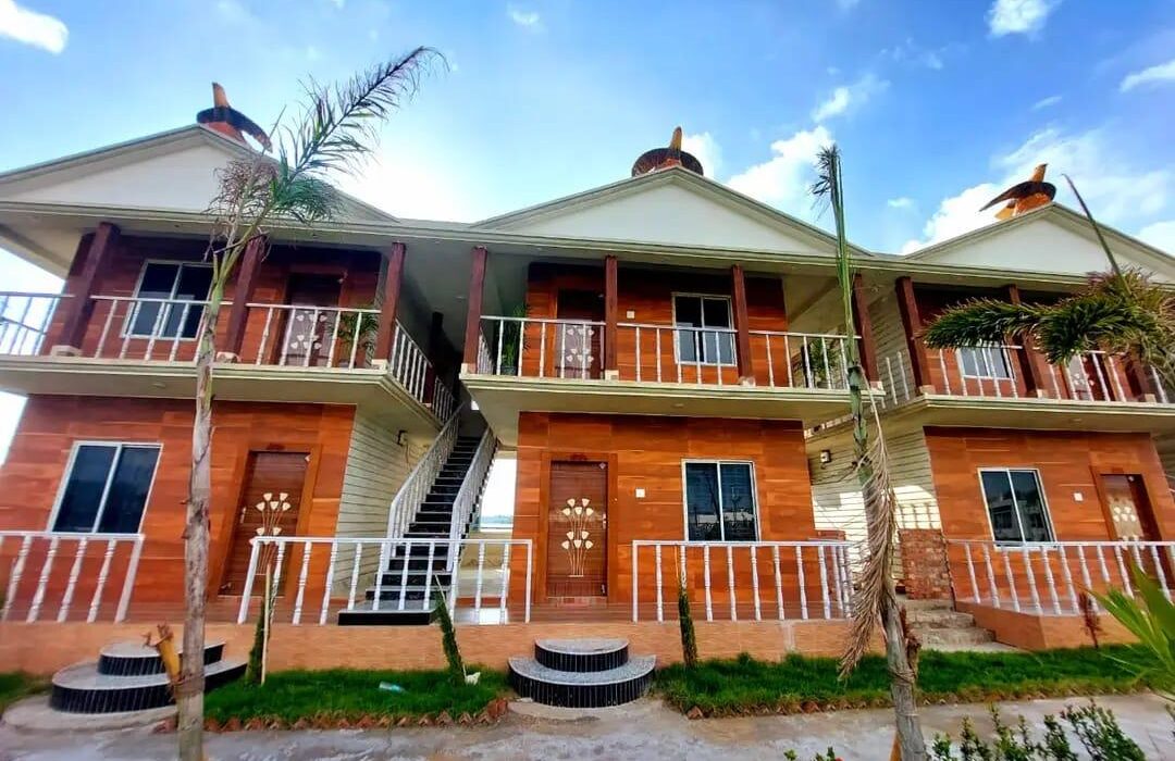Eagle Cottage exterior with signature eagle statues, Dakshina Hawa Resort